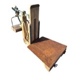 A set of sack scales with tapering weighing platform on hardwood frame, with swinging weight