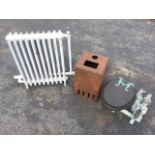 A painted cast iron radiator - 26in x 31in; a heavy cast iron rectangular box with vented front