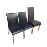 A pair of modern upholstered chairs on chromed legs; and a single faux leather highback chair on