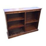 A mahogany open bookcase with rectangular moulded top above a dentil frieze, having two sets of