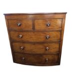 A Victorian bowfronted mahogany chest of drawers, with two short and three long cockbeaded drawers