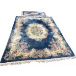 A handmade Chinese Tientsin wool carpet with ivory and pastel floral central lozenge and folate