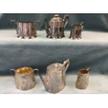 A late Victorian three-piece silver plated teaset with tapering moulded bodies engraved with leaf