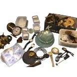 The contents of a clock restoration workshop including dials, springs, glasses, watches,