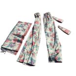 A pair of lined floral cotton curtains with pleated pelmet and two tiebacks. (56in) (5)