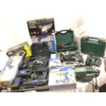 A quantity of boxed electrical power tools including drills, screwdrivers, spare batteries &
