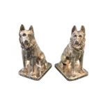 A pair of silver plated salt & pepper pots modelled as alsations, the dogs pierced for cruets seated