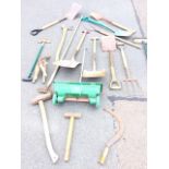 Miscellaneous garden tools including shovels, rakes, shears, axes, spades, scythes, forks, a lawn