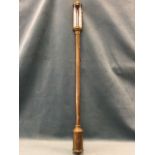 A suspended brass stick barometer, the tube with dial marked Roby Liverpool, having wall