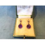 A cased pair of Edwardian amethyst and diamond drop earrings, with bezel set diamonds and circular