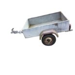 A galvanised rectangular box trailer on pneumatic tyres, the towbar complete with electric cable and