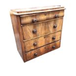 A Victorian mahogany chest of drawers having rectangular rounded top above a cushion moulded