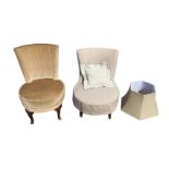 A bedroom/nursing chair with contemporary loose cotton cover and matching cushion; another similar
