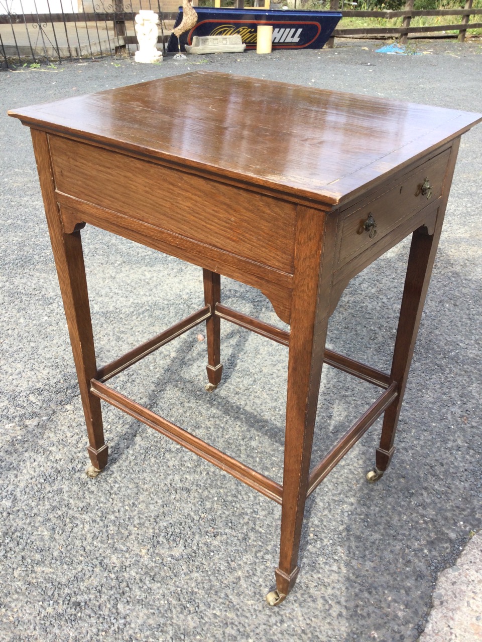 An Edwardian oak side table inlaid with chequered boxwood & ebony stringing, the rectangular top
