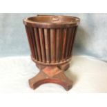A nineteenth century mahogany jardiniere with copper liner and swing handle, the bucket shaped