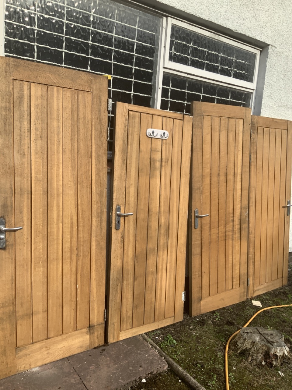 A set of four heavy solid oak doors with boarded panels, each with three hinges and steel - Image 2 of 3