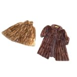 A lined ladies mink cape with arm openings; and a ladies lined three quarter length mink coat with