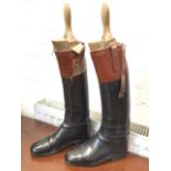 A pair of Peal leather hunting boots with tan calf collars, fitted with hardwood trees with shaped