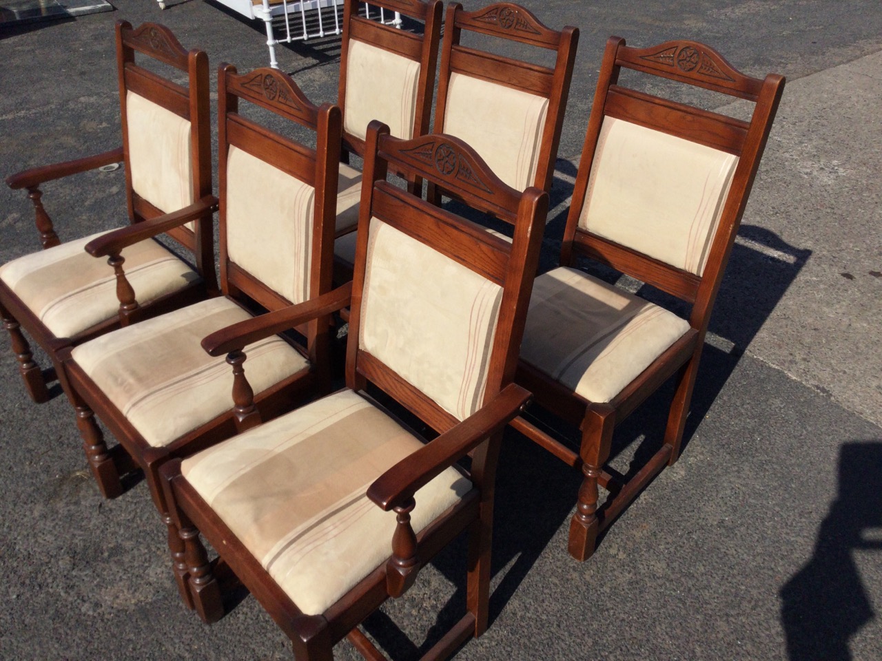 A set of six oak dining chairs with two carvers, the arched backs carved with floral medallions, - Image 2 of 3