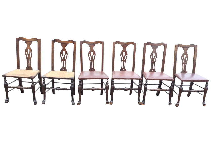 A set of six oak Queen Anne style dining chairs with shaped backs above pierced splats, having