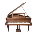 A mahogany cased Beulhoff baby grand piano, the instrument with seven octave keyboard raised on