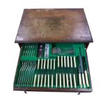 An oak cased canteen of Walker & Hall silver plated cutlery, the two baize lined drawers complete
