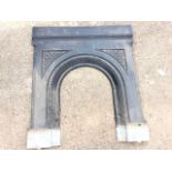 A nineteenth century cast iron fireplace with arched flowerhead moulded aperture beneath floral