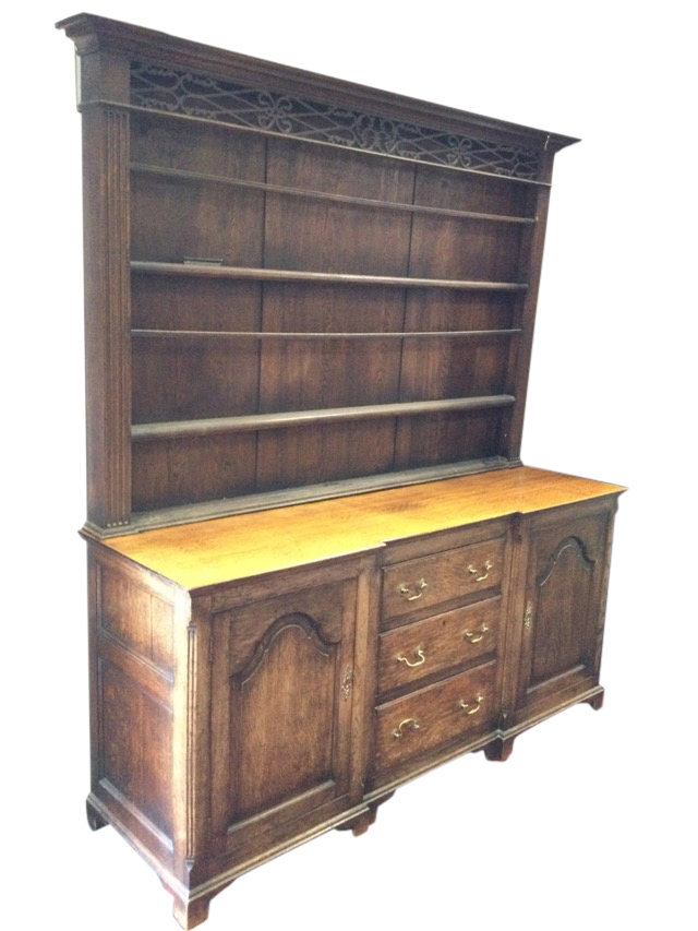 A nineteenth century 6ft breakfront oak dresser, the delft rack with moulded cornice above a pierced