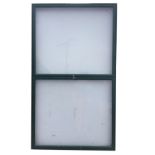 A rectangular noticeboard with two large hinged doors. (71in x 41.5in x 3in)