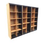 A faux beech storage unit in three sections, forming thirty square pigeonholes. (30.5in x 73in each)