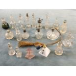 A collection of glass scent bottles, Caithness, engraved, cut, coloured, vinaigrette jugs, some with