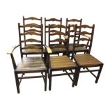 A set of six dowel jointed oak ladderback dining chairs, including two carvers, with arched rails in