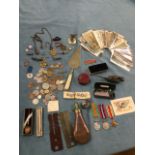 Miscellaneous collectors items including coins, medals, a silver cricket medal, an oil can, albert