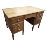 A rectangular hardwood desk with rectangular moulded top above a kneehole with frieze drawer flanked