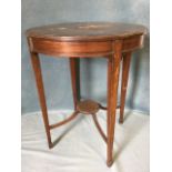 A circular mahogany lamp table, the top with scalloped ebony strung decoration above a frieze with