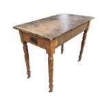 A Victorian oak table with later rectangular top, having drawer to end, raised on turned tapering