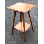 A square Edwardian mahogany plant table, the moulded top on square tapering angled legs joined by