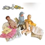 Three composition head dolls with jointed bodies - complete; and a quantity of dolls clothing - some