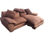 A large 8ft contemporary sofa/daybed with large right-angled cushion seat and loose cushions, raised