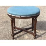 An oval Adams style carved mahogany stool, the stud upholstered seat on egg & dart rail, supported