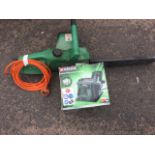 An Oregon electric chainsaw; and a boxed Parkside knife sharpner grinder. (2)