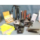 Miscellaneous items including a metronome, bicycle pumps, two recorders, a music stand, a bike