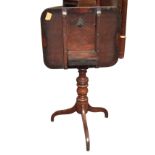 A nineteenth century mahogany snap-top occasional table, the rounded rectangular top on a turned