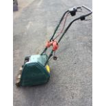 A Windsor 14S electric lawnmower with wood rollers and 14in cutting blade. (A/F)
