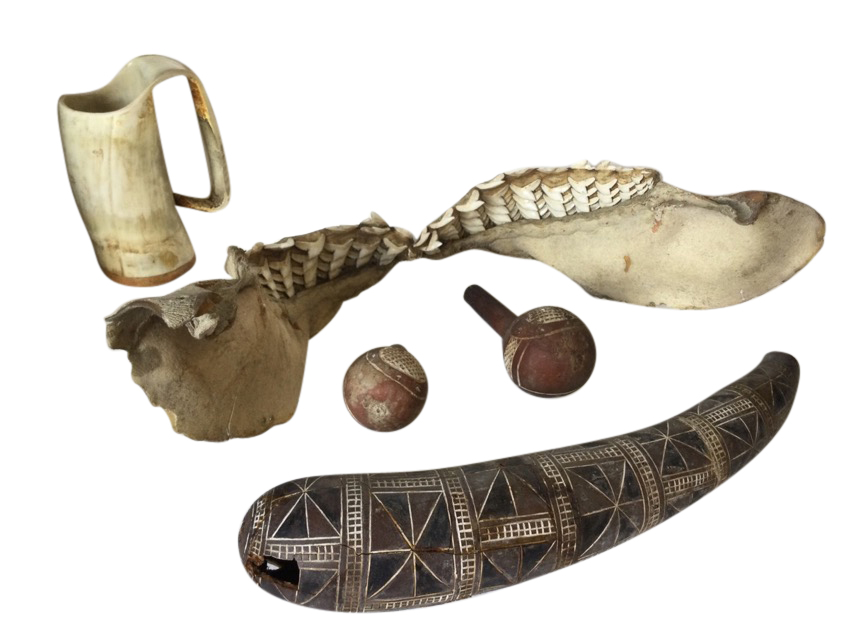 A shark jaw with rows of teeth; three carved gourd type vessels; and a carved & bent horn