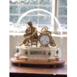 A Victorian ormolu & marble mantle clock under glass dome, the enamelled dial with blue roman