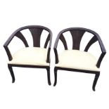 A pair of captain style armchairs, the rounded moulded rails on fluted fan shaped splats, the