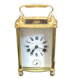 A French carriage clock in shaped architectural style case with moulded cornerposts having ball