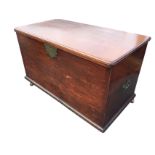 A large nineteenth century mahogany coffer with rectangular rounded moulded top above a box with