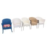 A set of four painted Lloyd Loom style armchairs, with rounded backs and horseshoe shaped sprung